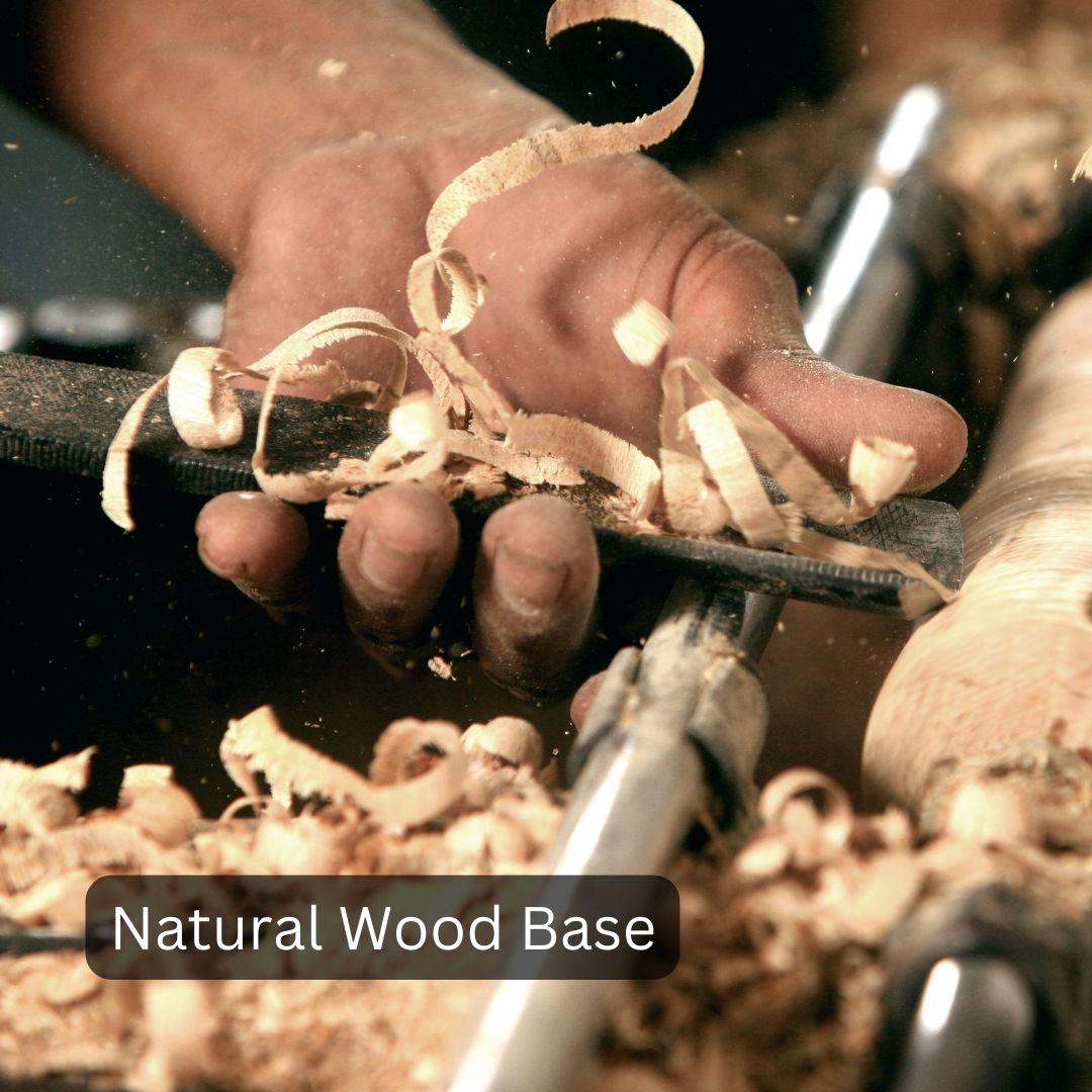 Hand holding a piece of wood with visible wood shavings, labeled 'Natural Wood Base'.