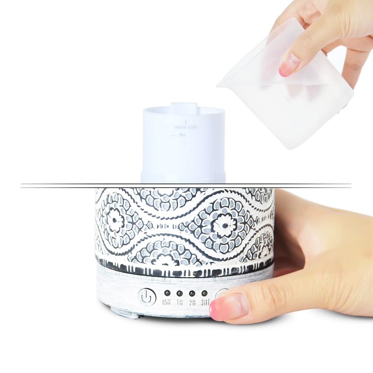 Patterned diffuser with a hand applying a patch, on a white background